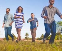 people walking in a field