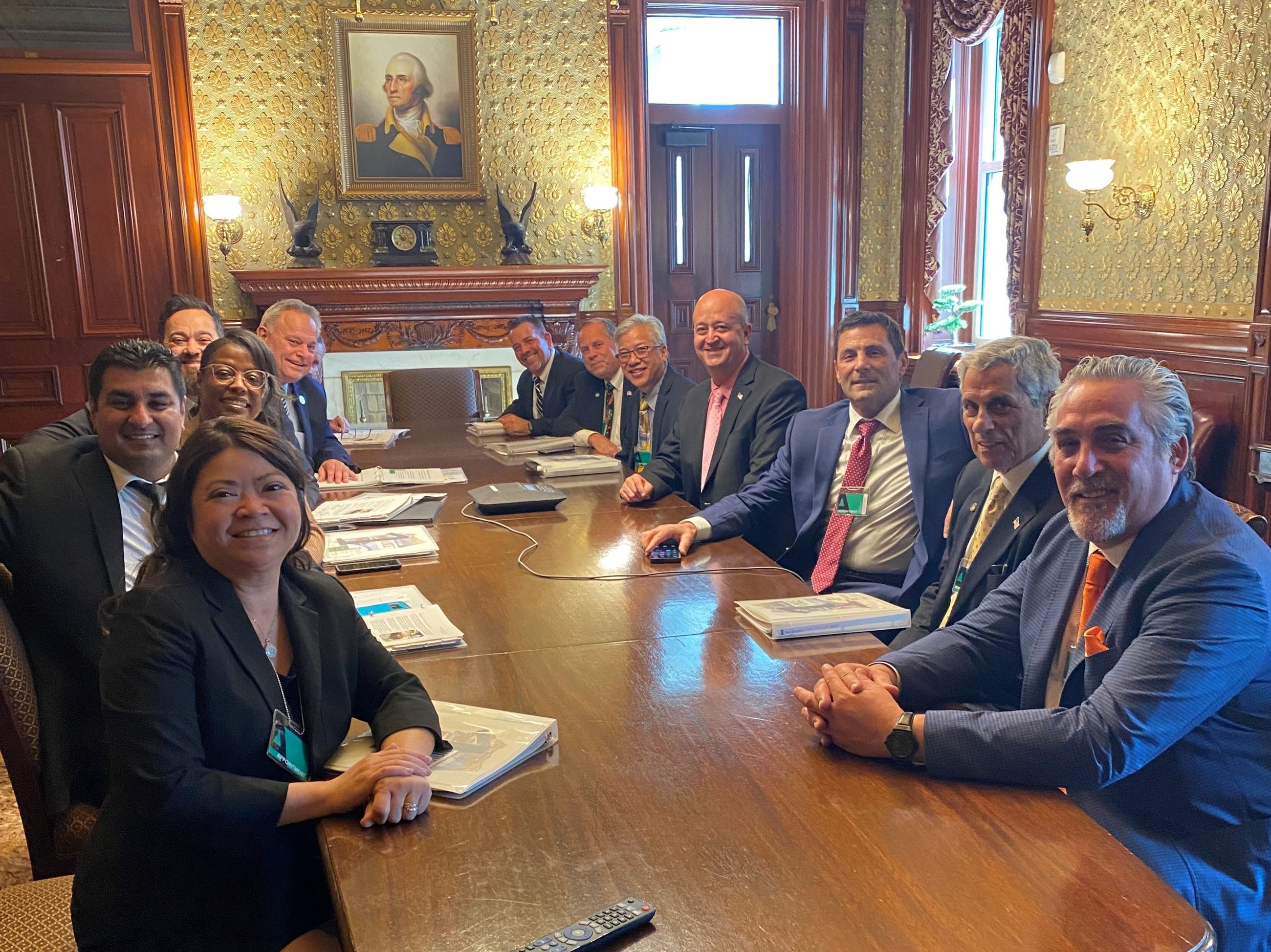 Members of the San Joaquin One Voice delegation sit around a conference table in Washington, D.C.