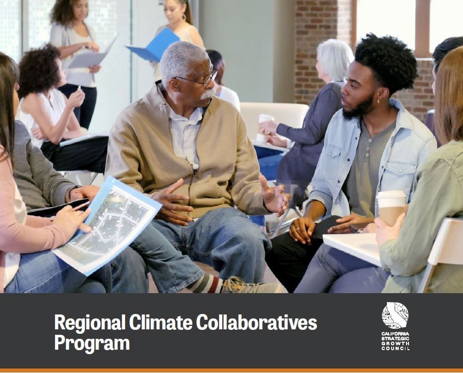 Image shows people gathered to discuss community issues.